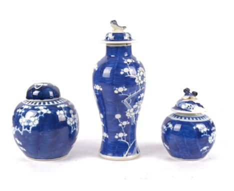 A group of three Chinese underglaze blue and white blossoming prunus on cracked ice pattern porcelain jars,  the tallest  exa