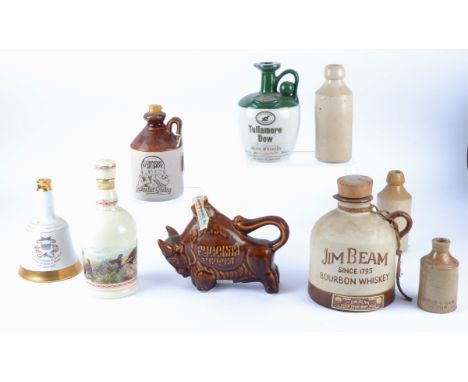 A selection of ceramic and stoneware beverage bottles, including Famous Grouse, Street &amp; Day, Cornish Scrumpy, T.Weaver, 