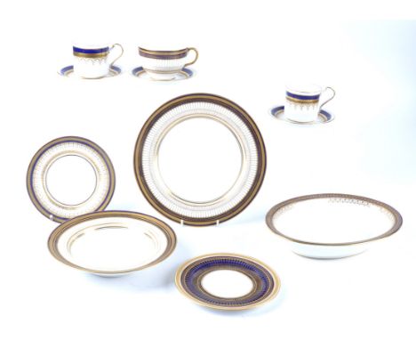 A Royal Doulton bone china part dinner service,  with gilt blue decoration, to include cups, saucers, dessert plates, large p