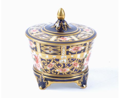 A Royal Crown Derby Imari lidded storage pot decorated in the 6299 pattern, raised on four feet with printed and painted mark