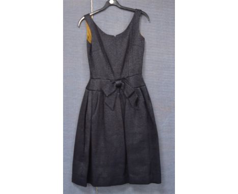 A lady's vintage 1950's Harrods dress, from the Création de Paris series, black fabric with a brown lining, designed with a p