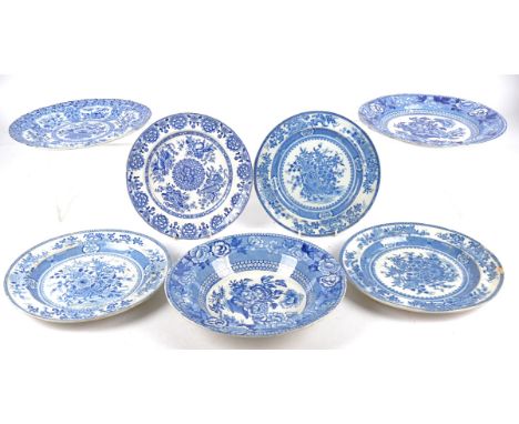 Seven pieces of Georgian and later blue and white transfer printed pottery with botanical subjects and designs influenced by 