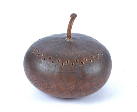 A 19th Century Corsican carved gourd of Napoleonic interest, the lid with floriform borders and piercing, engraved 'Ajaccio'.