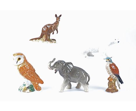 Four Beswick ceramic animal figures, including a Kestrel (model no. 2316), an Owl (model no. 1046), Polar Bear (model no. 153