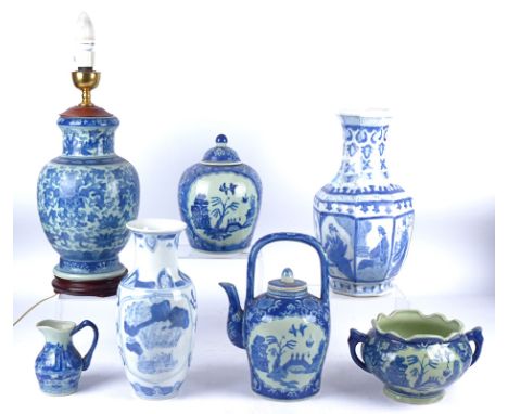 A 20th Century Chinese blue and white lamp base,  with  lotus flowers and a lapet border, height of base 34cm, together with 