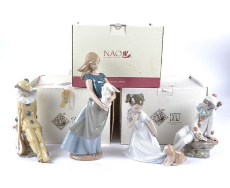Four Nao figures, a girl holding a rabbit, a girl playing with a puppy and two clowns, all in original boxes (4)