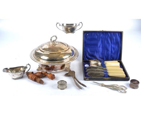 A selection of silver plate, consisting a tureen with lid, a boxed set of fish knives, a nutcracker modelled as a bird's head