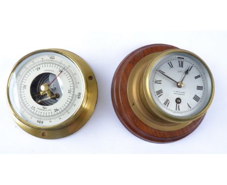 A 20th Century Smiths brass cased clock and barometer,  the clock on wooden circular mount, diameter 19.5cm (2) 