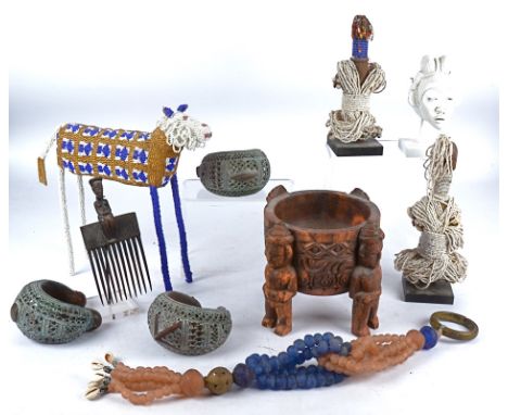 Four brass Benin style bracelets or armlets together with a selection of tribal wares including, two farli beaded dolls, bead