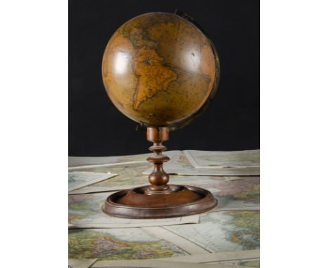 A pair of Newton's terrestrial and celestial globes on turned stands dated 1851, with brass bracket on turned mahogany pedest