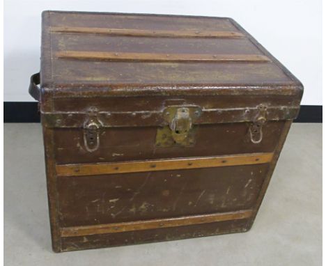 A Steamer Travel trunk by John Cattnach of New York, having leather carry handles to either side, wooden struts to the lid, 6