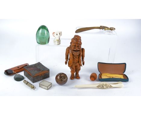A Black Forest treen nutcracker in the form of a gnome like Gentleman with manual automaton opening his wide mouth, height 22