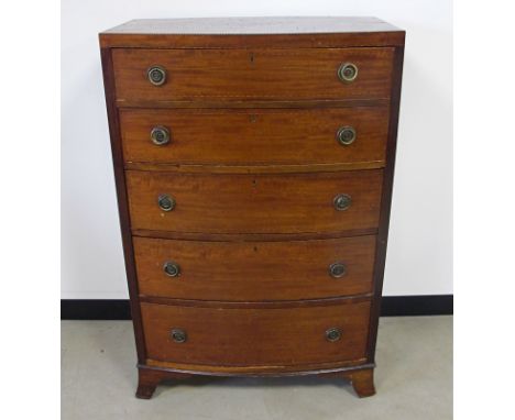 An Edwardian Mahogany bow fronted chest of drawers, having five graduated drawers, inlaid work to the top and the drawers, wi