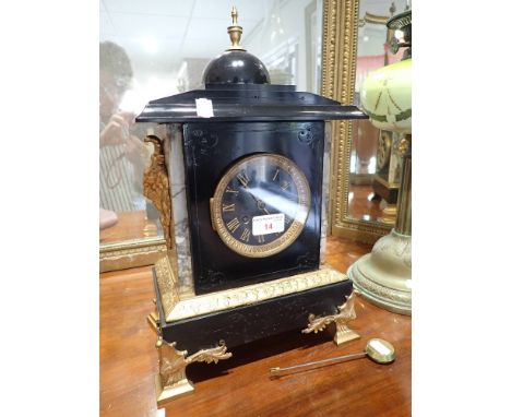 AN EBONISED AND GILT METAL BRACKET CLOCK in Regency style, 40cms high (on view at Fine Art)