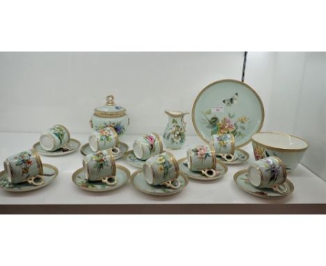 A CERAMIC PART TEA SERVICE decorated with flowers and butterflies with gilt embossed banding (on view at Fine Art)
