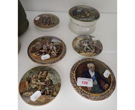 A COLLECTION OF CERAMIC JAR COVERS painted with different scenes to include a portrait of the late Duke of Wellington and oth