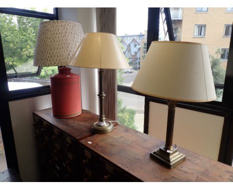 A GILT COLUMN LAMP and two further table lamps (3) (on view at Fine Art)