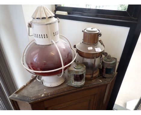 A WHITE PAINTED SHIP'S LAMP and three further brass lights (4) (on view at Fine Art)