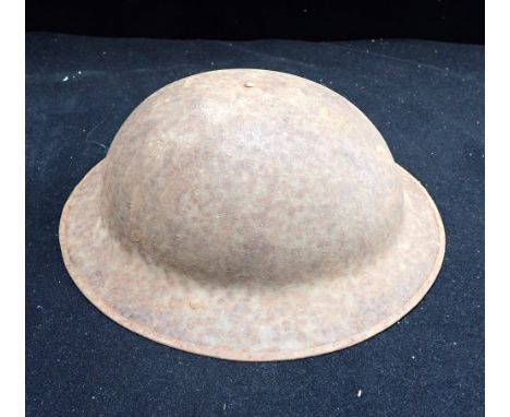 A FIRST WORLD WAR TIN HELMET 