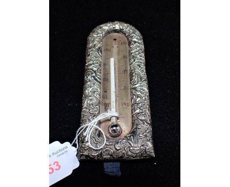 A FRENCH EMBOSSED SILVER FRAMED THERMOMETER, 14cm long