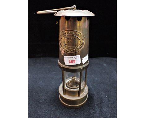 A BRASS MINER'S LAMP by 'E Thomas &amp; Williams' 