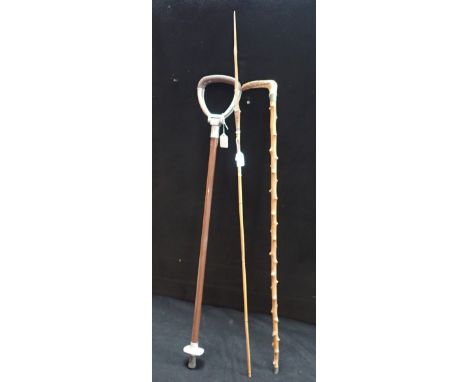 A SHOOTING STICK, a horn handled walking stick and an arrow (3)