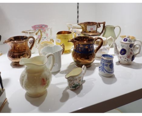 A COLLECTION OF SMALL CERAMIC JUGS (on view at Fine Art)