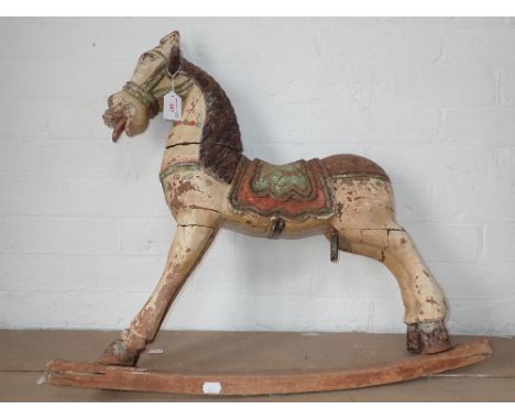 AN INDIAN CARVED AND PAINTED CHILD'S ROCKING HORSE (examine)
