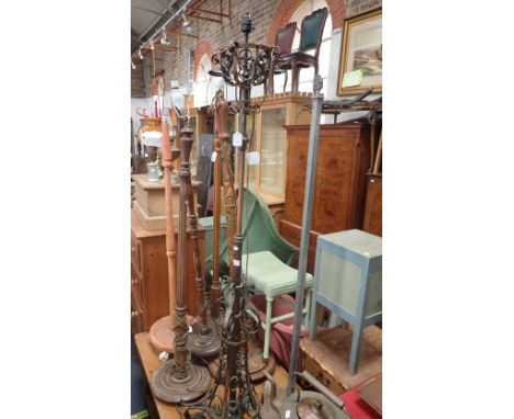 A VICTORIAN COPPER STANDARD LAMP (fitted for electricity), an Art Deco standard lamp and five other standard lamps
