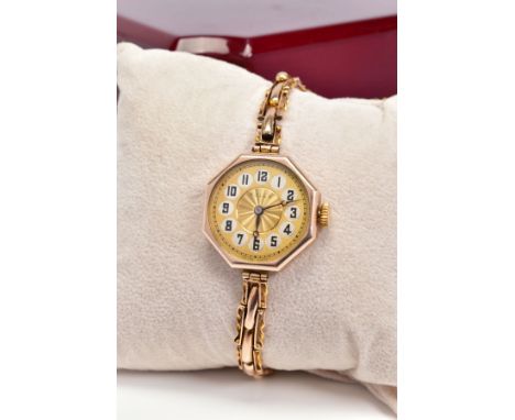 A 9CT GOLD HAND WOUND HEXAGONAL ROLEX WRISTWATCH, engine turned centre with white and black Arabic numerals to the dial, hall