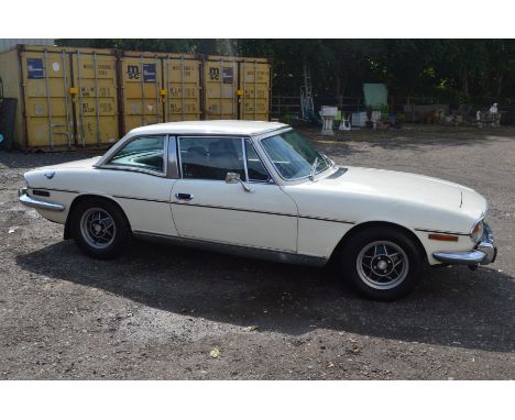 A 1973 TRUIMPH STAG 3.0 LITRE V8 AUTOMATIC CONVERTIBLE CAR WITH COUPE HARD TOP FINISHED IN WHITE, this car was first register