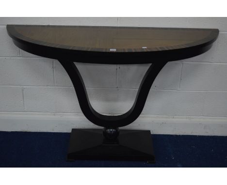 A MODERN HARDWOOD AND EBONISED EFFECT DEMI LUNE CONSOLE TABLE, on a u-shaped and rectangular base, width 139cm x depth 45.5cm