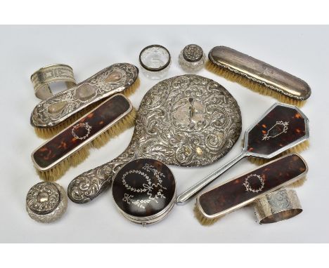 A SMALL BOX OF DRESSING TABLE ACCESSORIES, to include a pair of silver and tortoiseshell panel brushes, a pair of silver embo