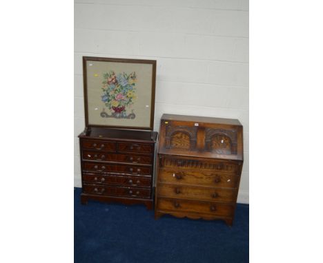 A LATE 20TH CENTURY OAK BUREAU with four drawers, a narrow modern mahogany chest of six drawers and an oak firescreen (3)