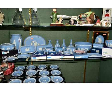 A COLLECTION OF BOXED AND LOOSE WEDGWOOD JASPERWARE, in pale blue and pink, including framed oval plaque, pin dishes, vases, 