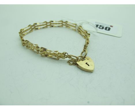 A Gate Style Panel Bracelet, of openwork design stamped "9.375", to gold heart shape padlock clasp, (5 grams).