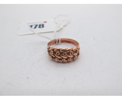 A 9ct Rose Gold 'Keeper' Style Ring, (finger size R) (3.5grams). 