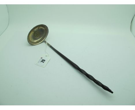 A Georgian Toddy Ladle, the oval bowl with inset with a George III 1819 shilling (gilt), with twisted handle, 29.5cm long. 