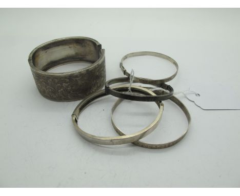A Victorian Wide Hinged Bangle, stamped "Standard", leaf scroll engraved to the front; Together with Another Hallmarked Silve
