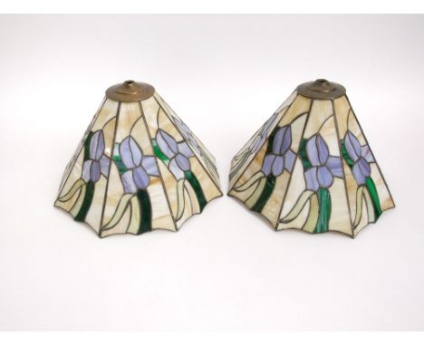 A pair of Tiffany style leaded good glass light shades of tapered faceted form, decorated with Iris', 22cm high (2)