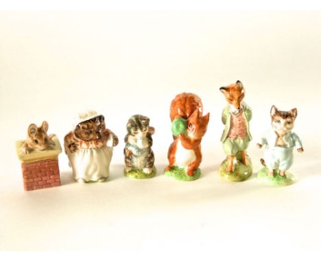 A collection of two Beswick Beatrix Potter figures of Miss Moppet and Squirrel Nutkin, together with four Royal Albert Beatri