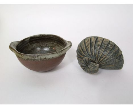A St Ives studio pottery bowl with two handles and mottled grey glaze to the interior and rim against a dark terracotta colou