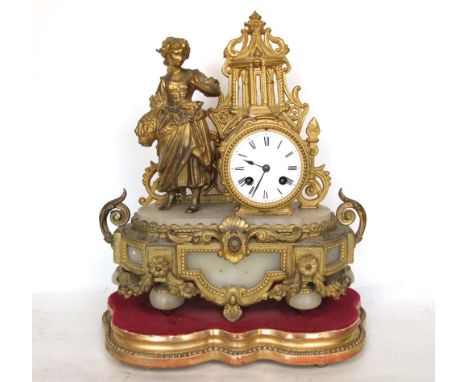 French gilt metal figural mantle clock, mounted by a female farm hand with alabaster type panels, the 8cm two train enamelled
