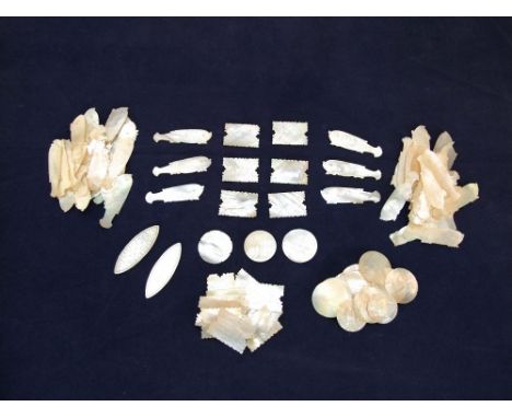 Approx 90 19th century Chinese mother-of-pearl counters in the form of fish and geometric shapes