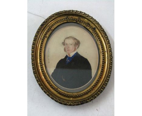 A 19th century portrait miniature of oval form showing a half length portrait of a gentleman in black jacket and blue cravat,