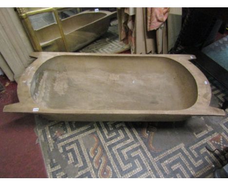 A substantial timber trough with carrying handles, 140 cm max