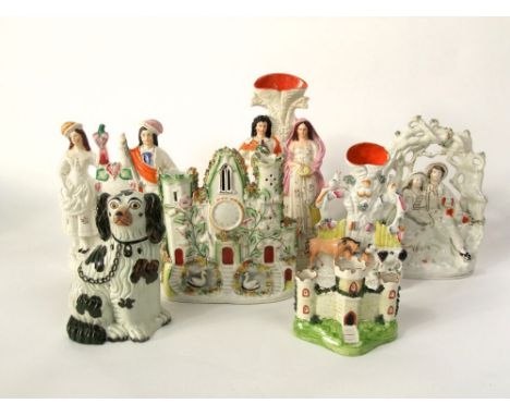 A collection of 19th century and other Staffordshire wares including a spill vase with applied male and female characters, he