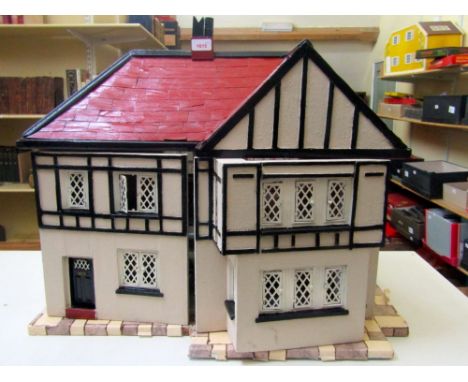 Scale model doll's house, fitted with various furniture and in a mock Tudor manner