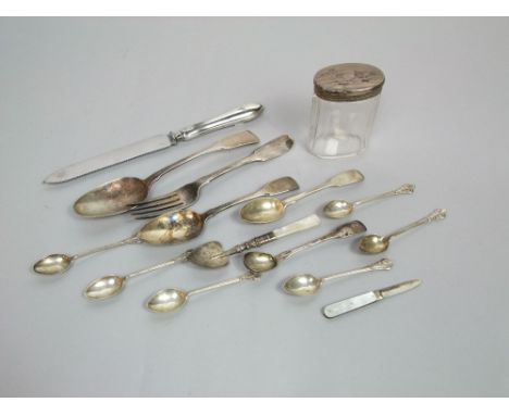 A mixed collection of silverware, mother-of-pearl and silver bladed fruit knife, silver topped jar