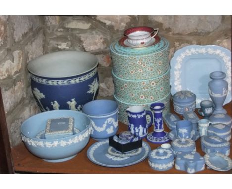 A quantity of Wedgwood Jasperwares including a dark blue ground jardiniere, 23cm tall, various trinket boxes and covers in a 